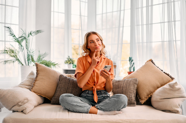 Couple cheers at laptop